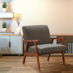Poltrona Karkkila Mid-Century imbottita con gambe in legno